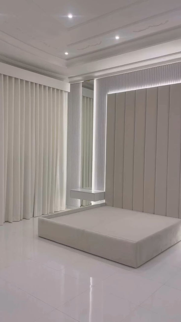 Custom white bedroom with back lighting for a luxurious and serene design.